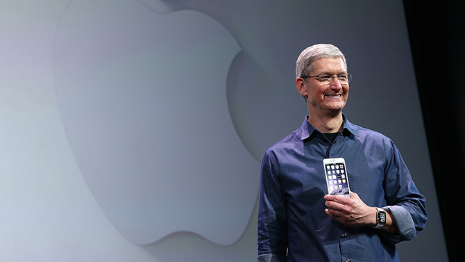 CUPERTINO, CA - SEPTEMBER 09: Apple CEO Tim Cook shows off the new iPhone 6 and the Apple Watch during an Apple special event at the Flint Center for the Performing Arts on September 9, 2014 in Cupertino, California. Apple is expected to unveil the new iPhone 6 and wearble tech. (Photo by Justin Sullivan/Getty Images)